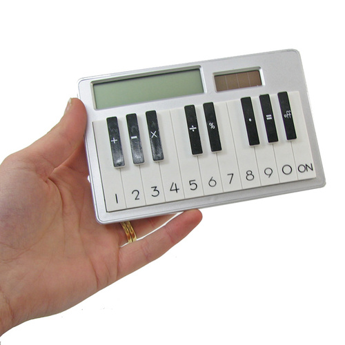 Piano Calculator This unique piano shaped calculator makes crunching